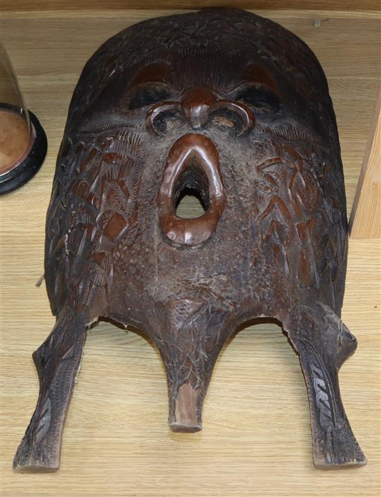 Three large carved Kenyan hardwood masks longest 70cm